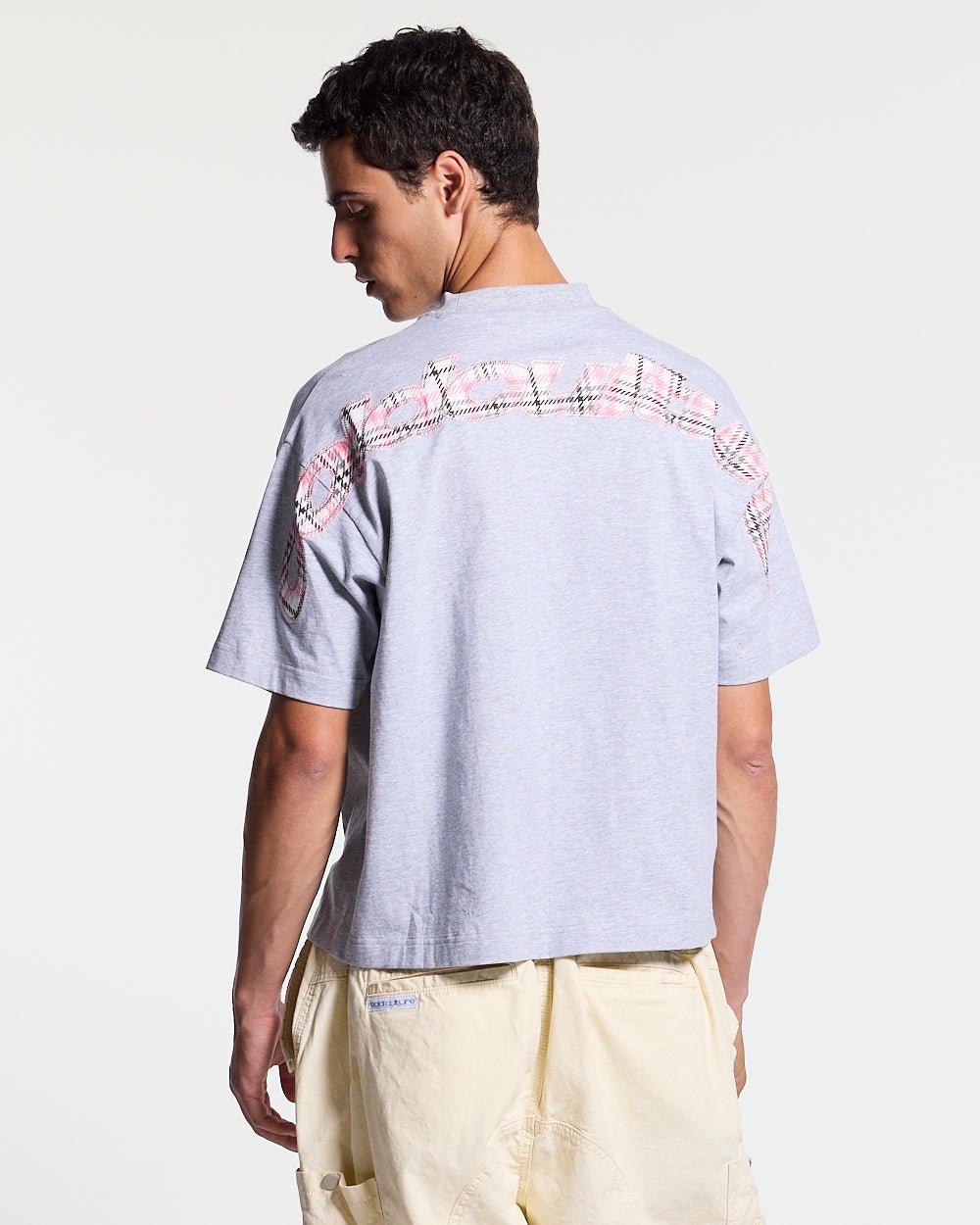 TARTAN DISTRESS CURVED TEE GREY - grey tartan detail tee, back view on male model - Cold Culture #man