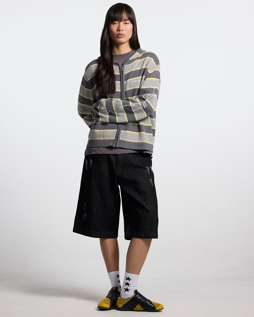 TOXIC SHORTS BLACK DENIM - black distressed denim shorts, front view on female model - Cold Culture #woman