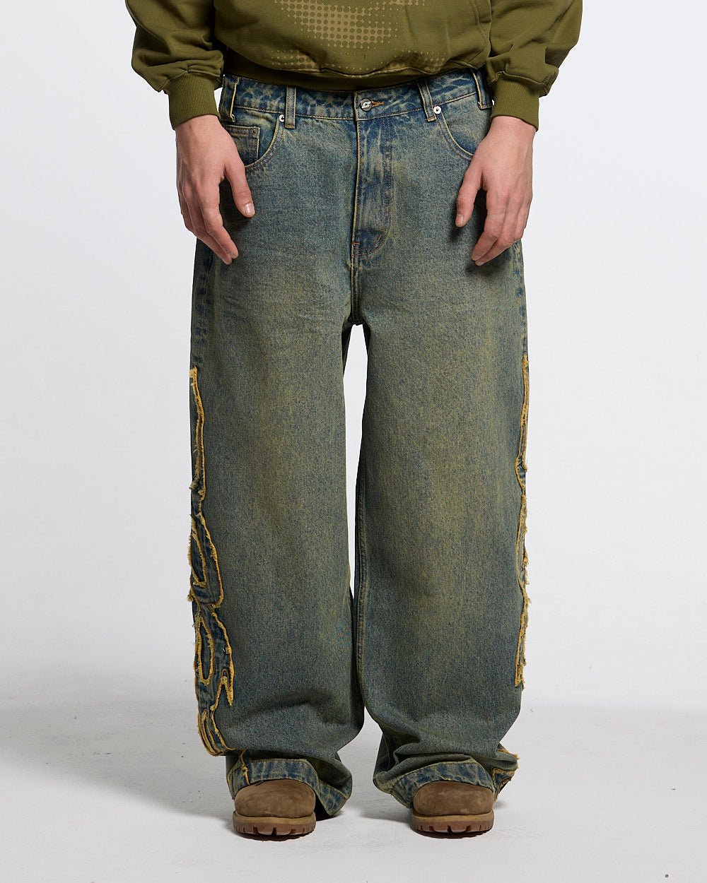 TRIBAL DISTRESSED V2 PANTS GREEN WASHED DENIM - distressed green denim pants, front view on male model - Cold Culture