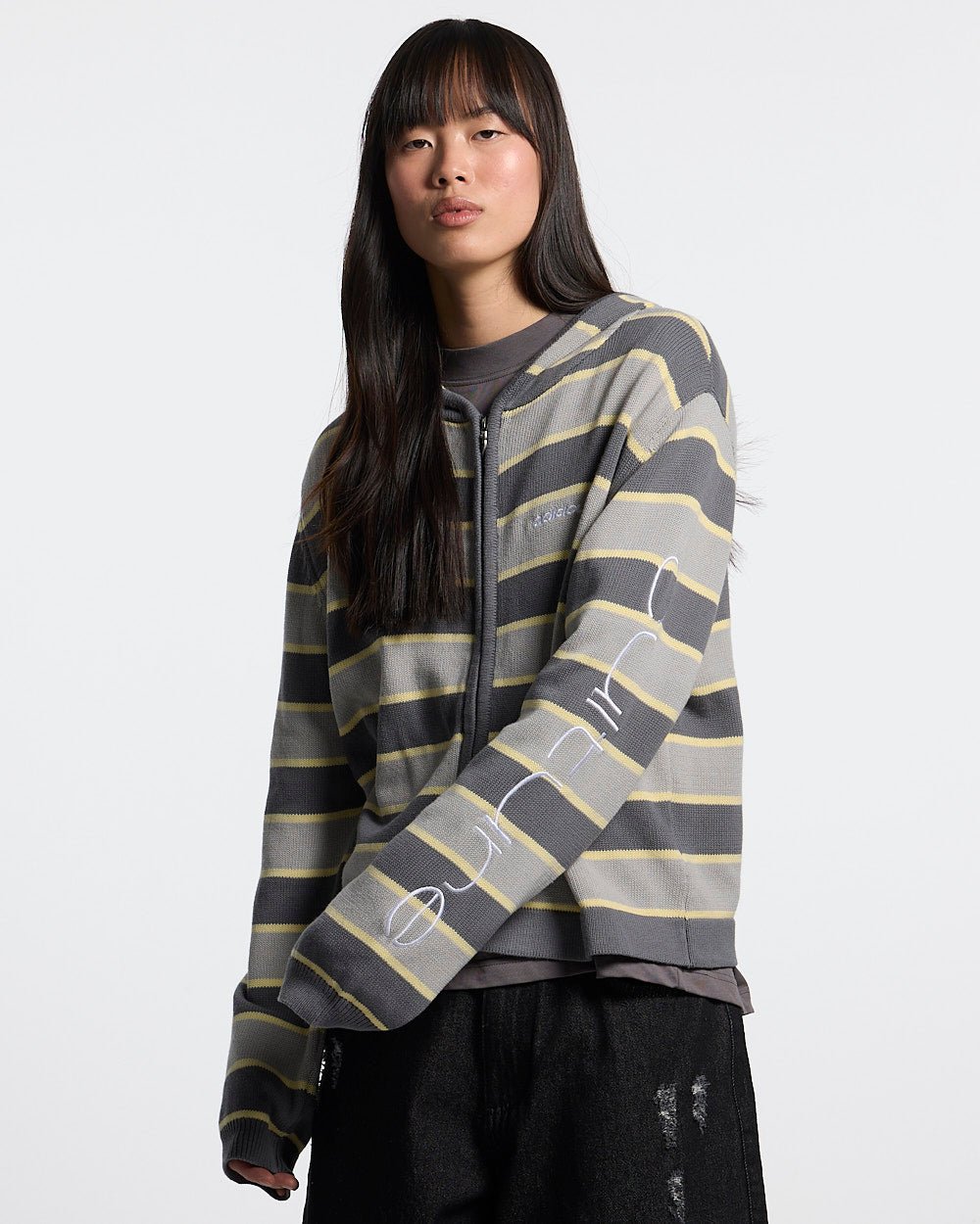 TRIPPY STOP ZIP KNIT GREY - grey striped zip-up knit sweater, front view on female model - Cold Culture #woman