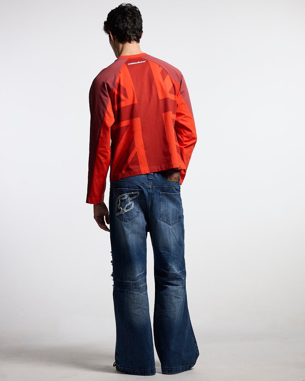UNION LONGSLEEVE RED - red football-style longsleeve tee, back view on male model - Cold Culture #man