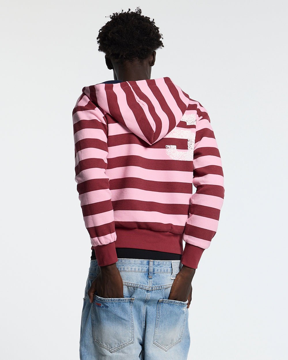 UNTRUE WAFFLE REVERSIBLE ZIP HOODIE PINK - pink striped reversible zip-up hoodie, back view on male model - Cold Culture #man