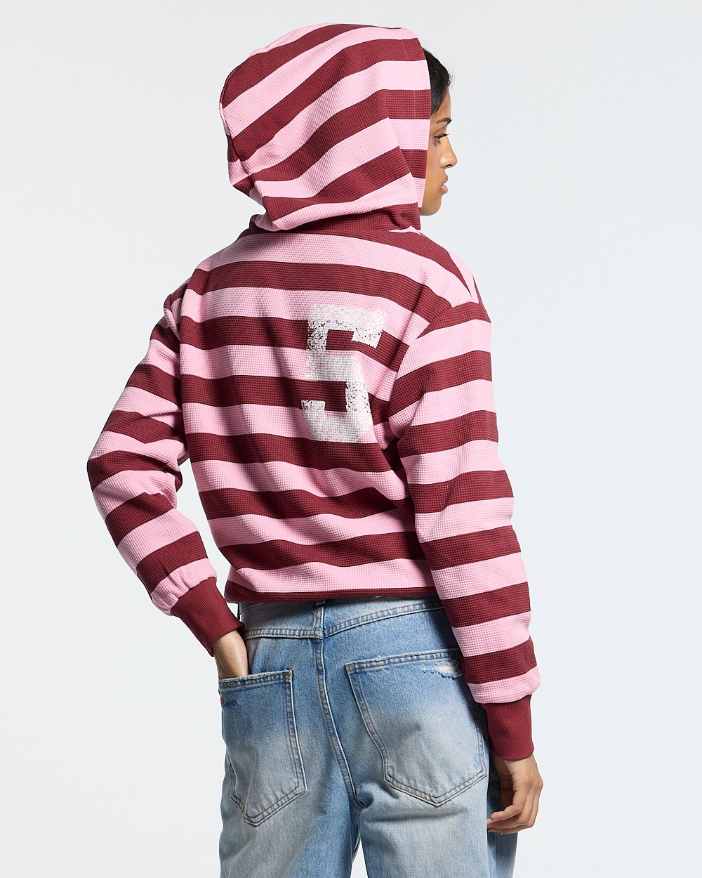 UNTRUE WAFFLE REVERSIBLE ZIP HOODIE PINK - pink striped reversible zip-up hoodie, back view on female model - Cold Culture #woman