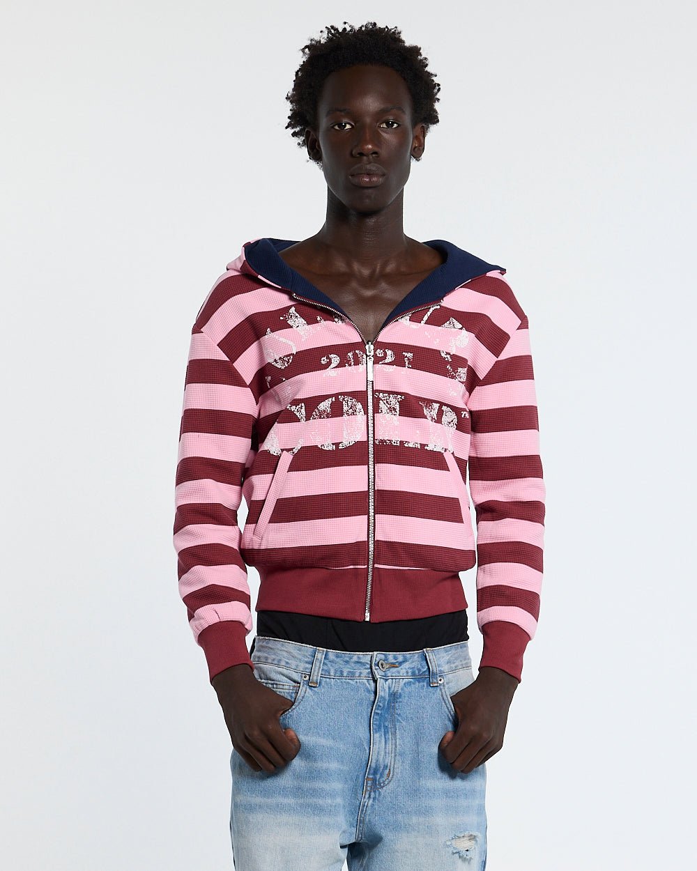 UNTRUE WAFFLE REVERSIBLE ZIP HOODIE PINK - pink striped reversible zip-up hoodie, front view on male model - Cold Culture #man