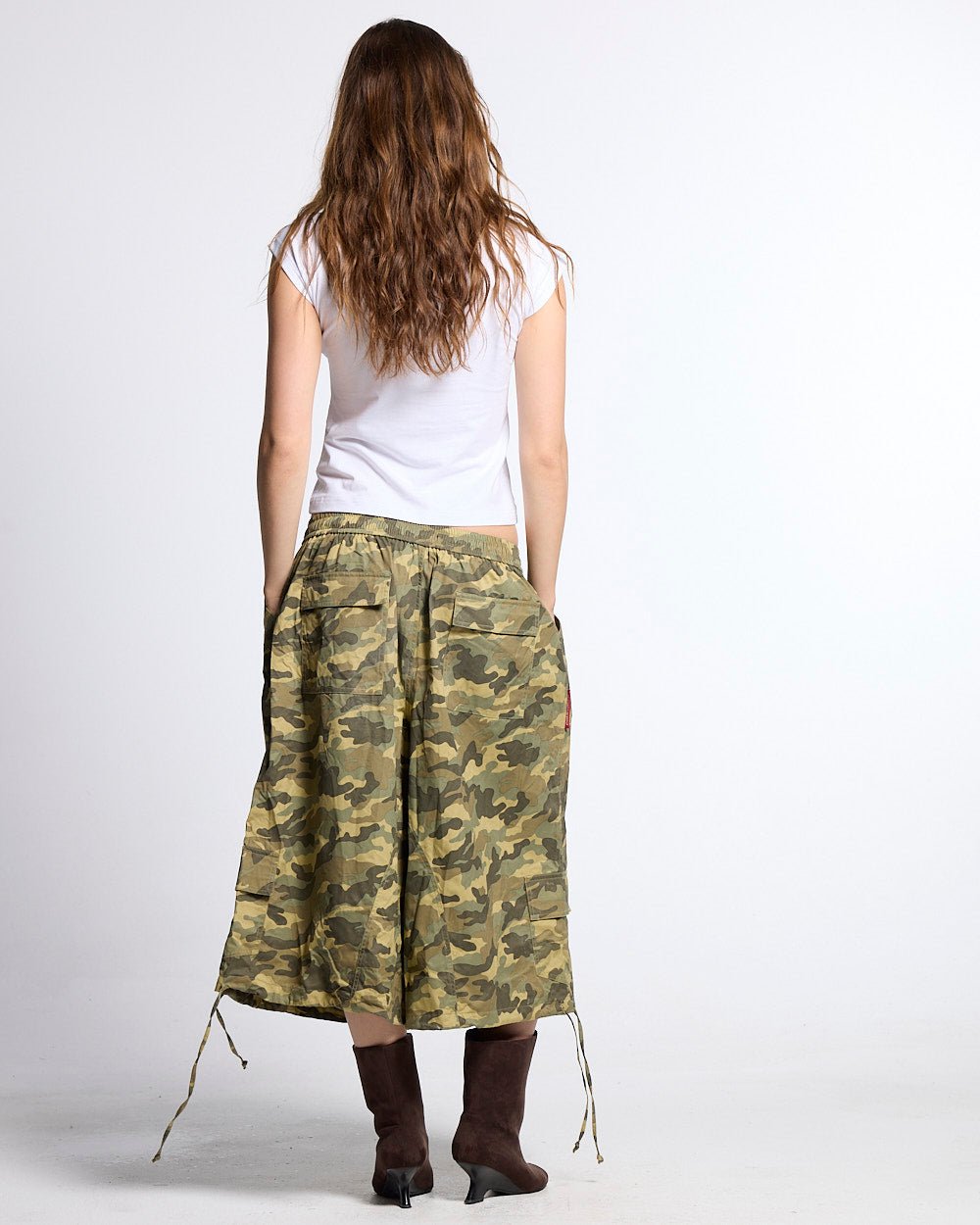 UTILITARY CAPRI PARACHUTE CAMO - camo cargo capri shorts, back view on female model - Cold Culture #woman