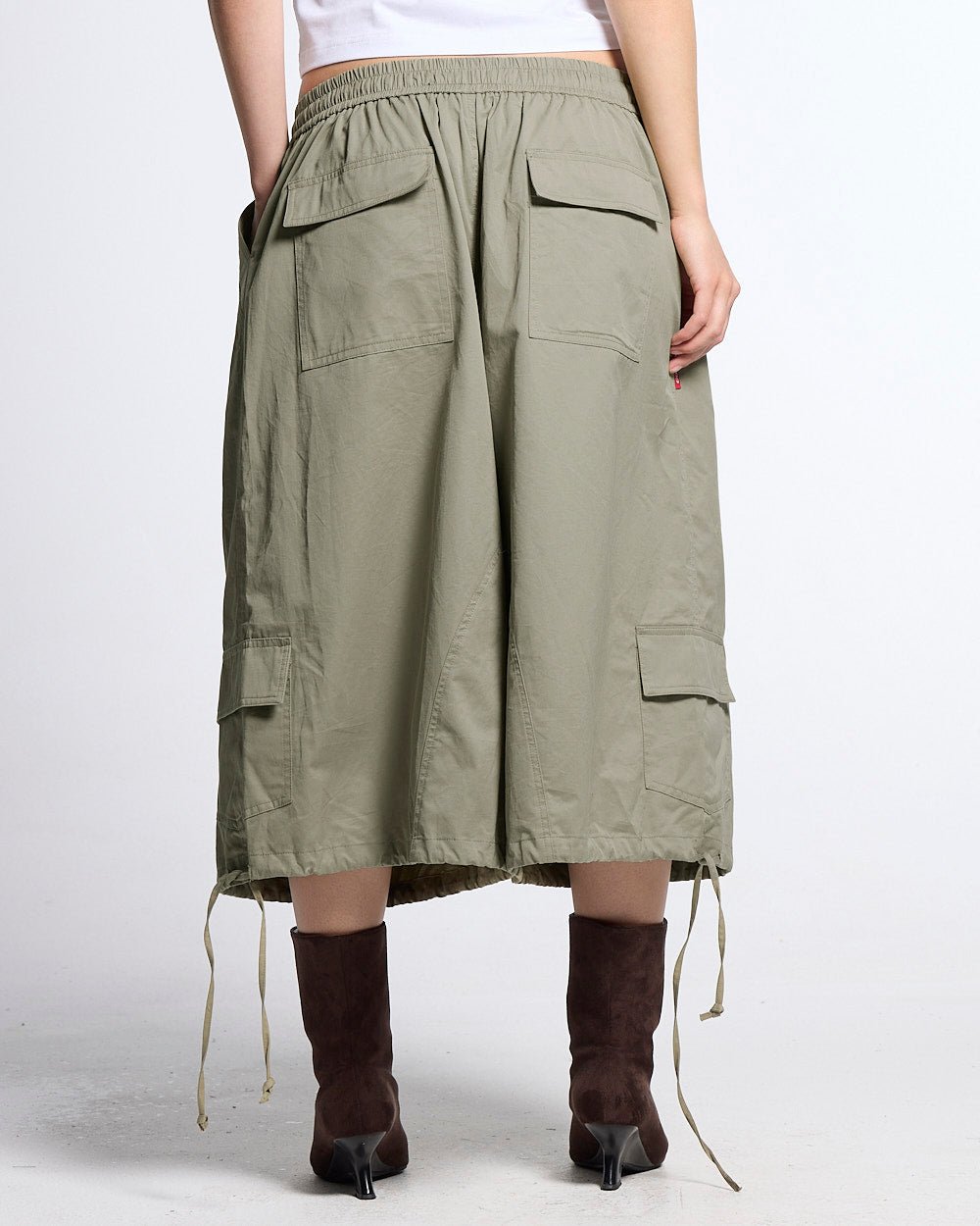 UTILITARY CAPRI PARACHUTE CREAM - khaki cargo capri shorts, back view on female model - Cold Culture #woman