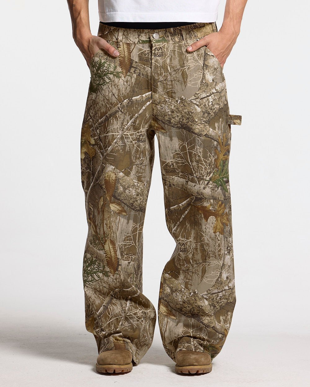 V1 CARPENTER PANTS REALTREE - realtree camo carpenter pants, front view on male model - Cold Culture
