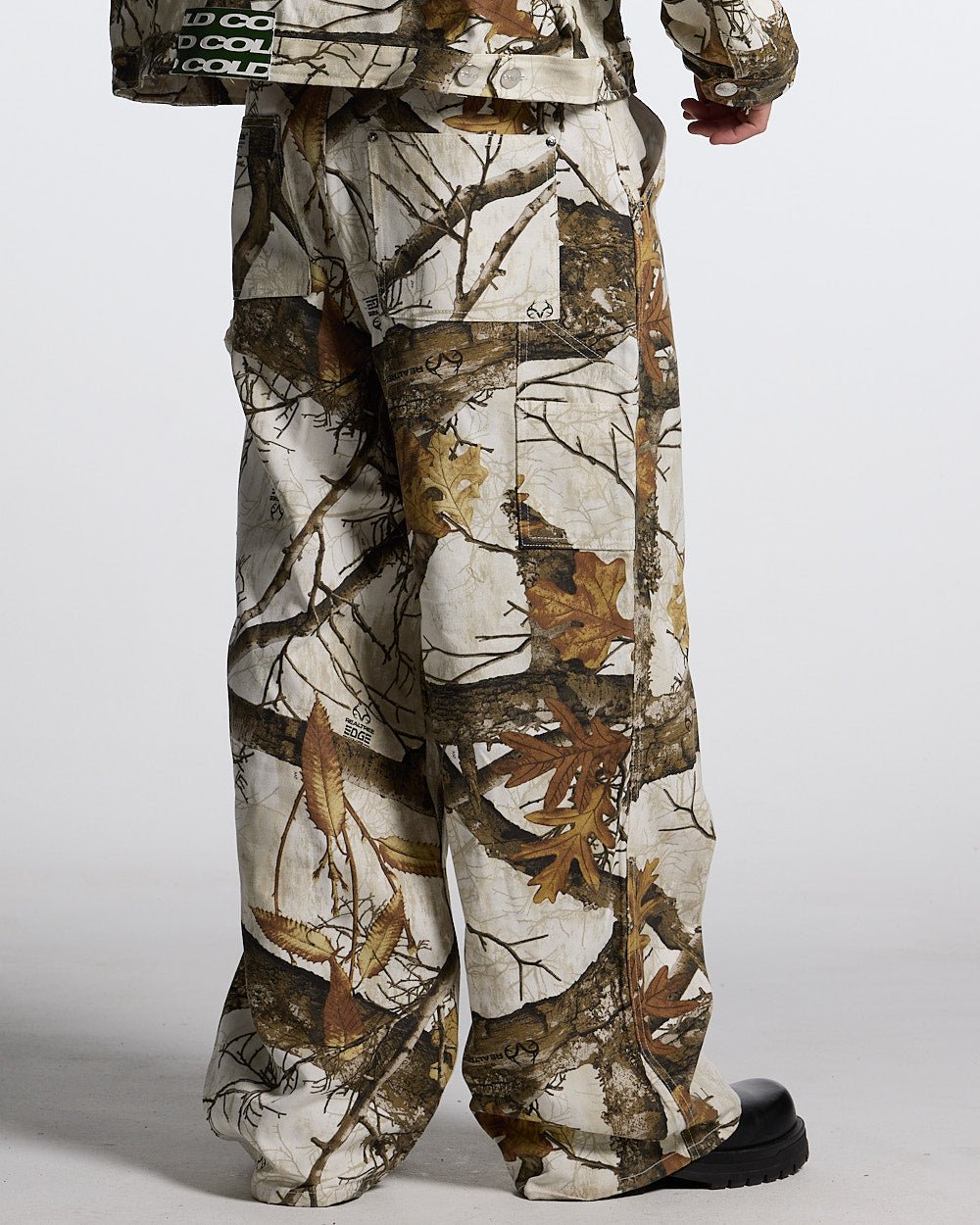 V1 CARPENTER PANTS REALTREE WHITE - white realtree camo carpenter pants, back view on male model - Cold Culture
