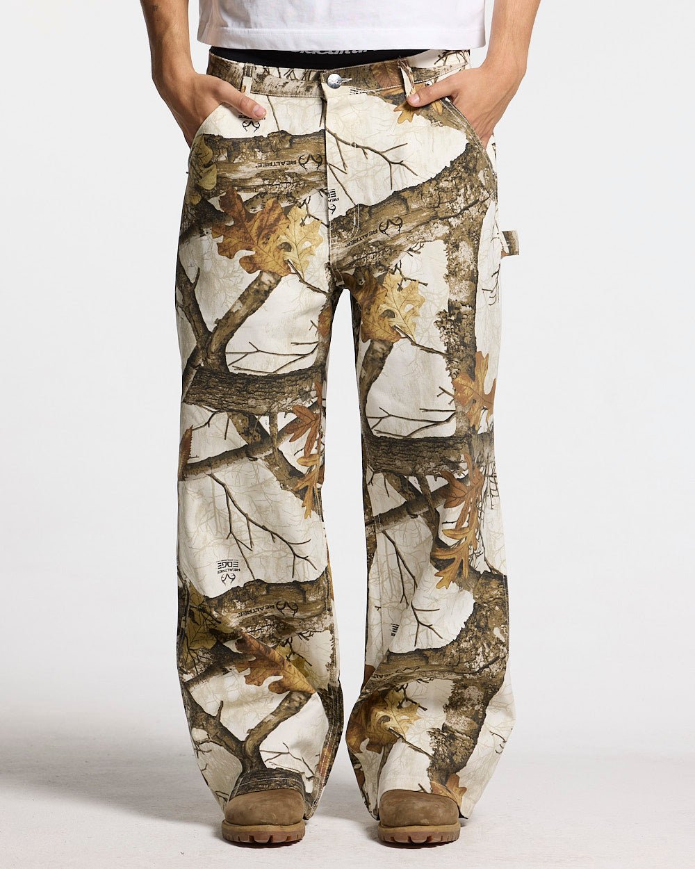 V1 CARPENTER PANTS REALTREE WHITE - white realtree camo carpenter pants, front view on male model - Cold Culture