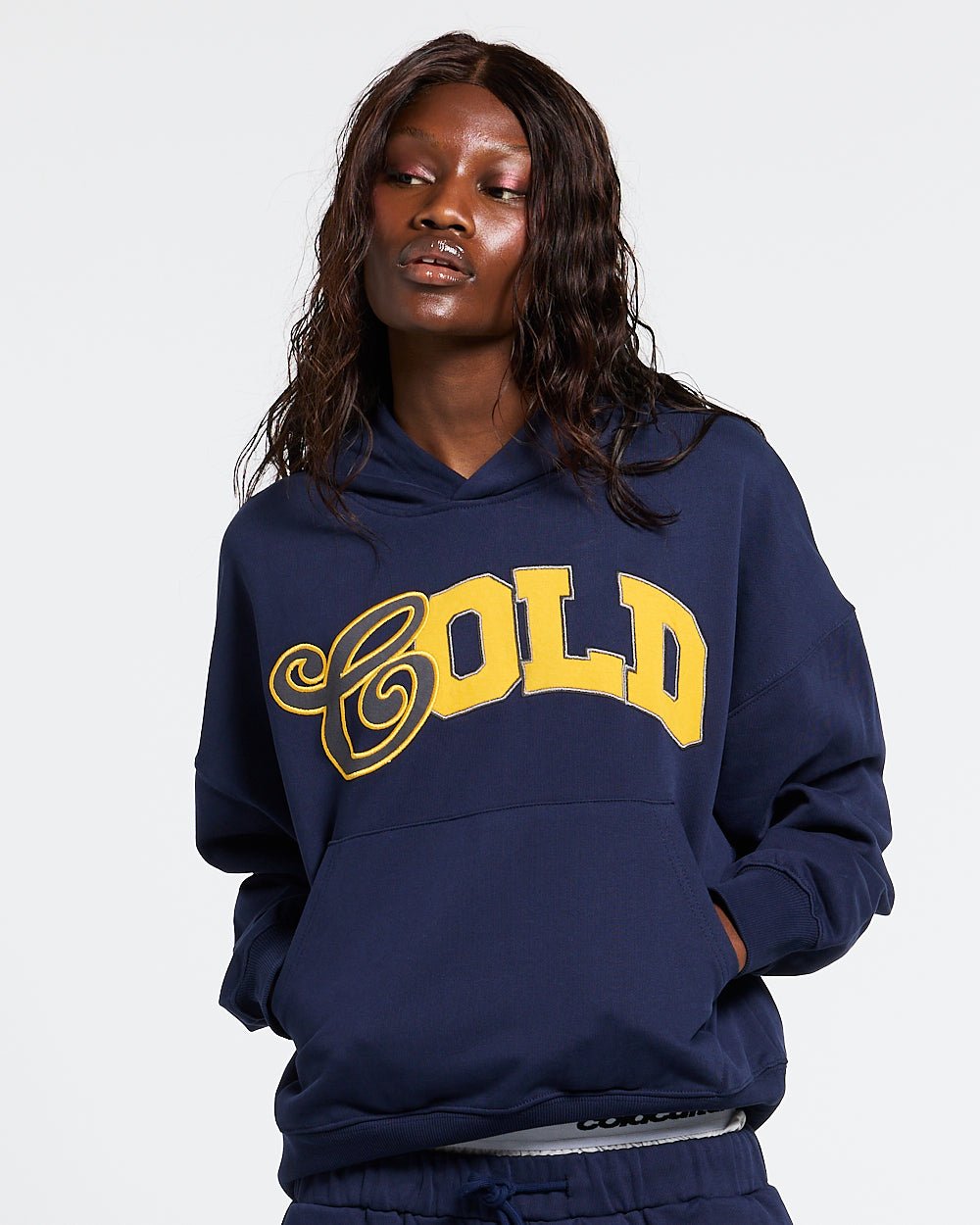 VARSITY HOODIE DARK BLUE - navy blue varsity print hoodie, front view on female model - Cold Culture #woman