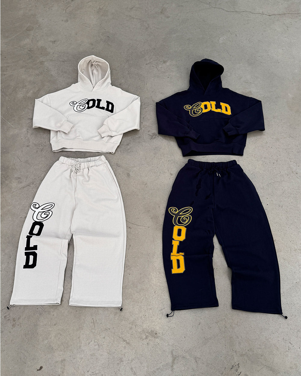 VARSITY HOODIE DARK BLUE - navy blue varsity print hoodie, flat lay with matching pieces - Cold Culture