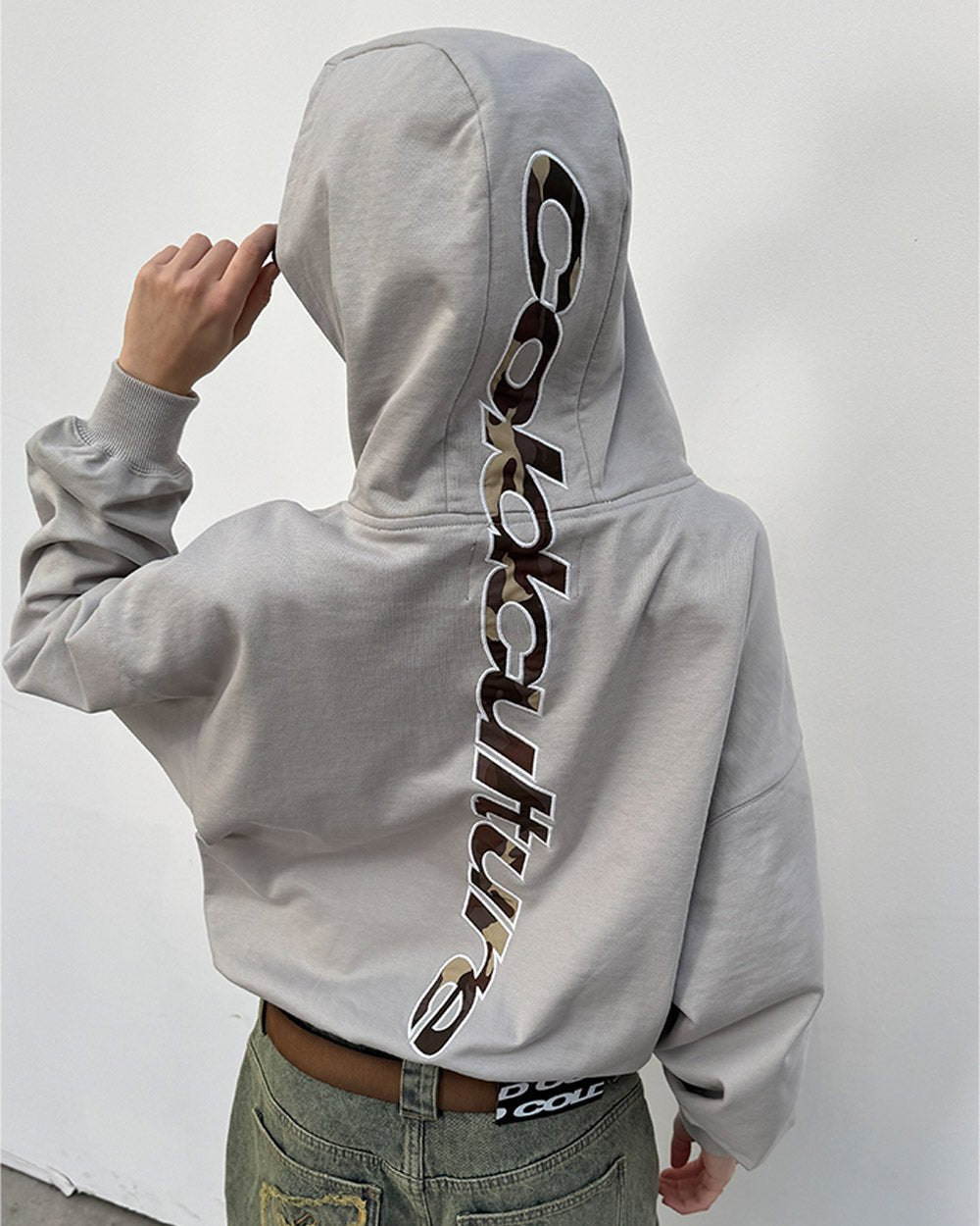 VERTICAL HOODIE LIGHT GREY - light grey oversized hoodie, back view on female model - Cold Culture #woman