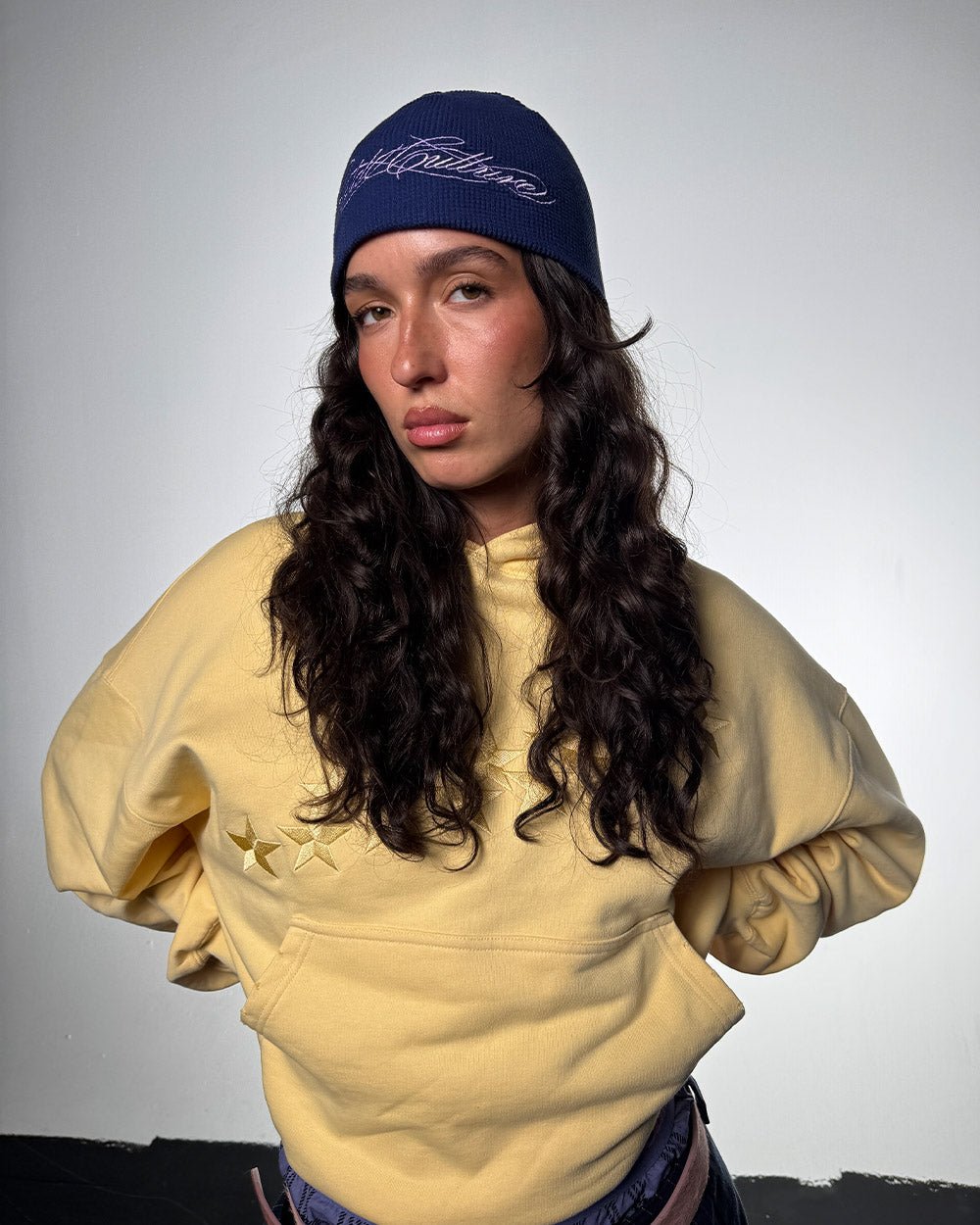 WAFFLE BEANIE BLUE - navy blue waffle knit beanie, front view on female model - Cold Culture #woman