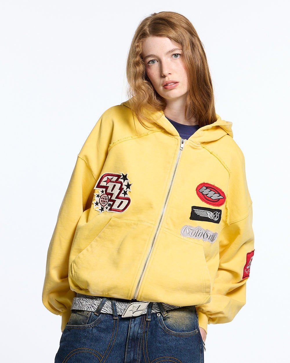 WALKER ZIP HOODIE YELLOW - yellow zip-up hoodie with patches, front view on female model - Cold Culture #woman
