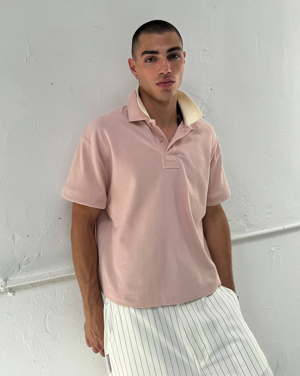 WHIP POLO PINK - pink oversized polo shirt, front view on male model - Cold Culture