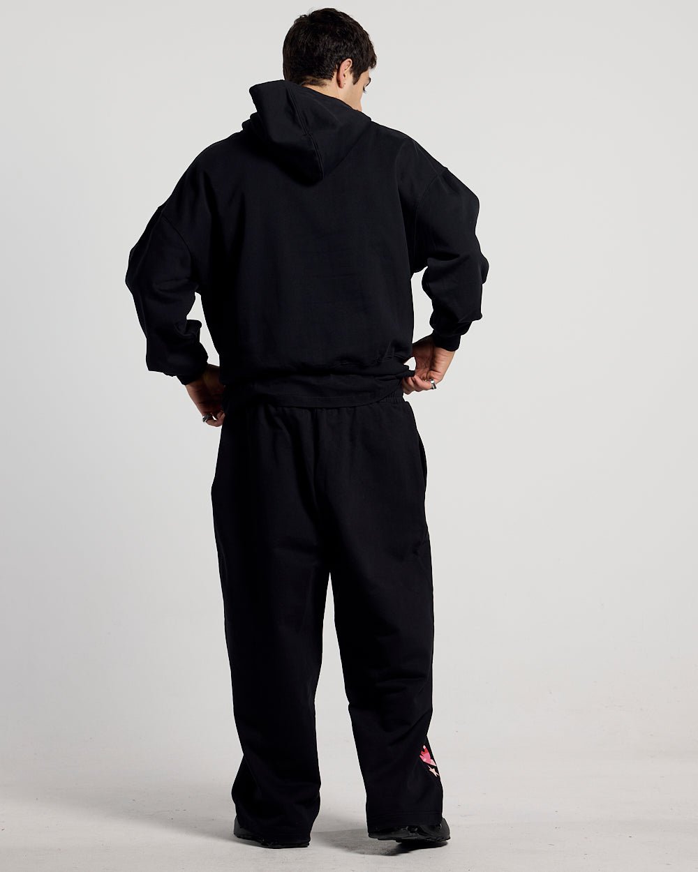 WILD CAMO HOODIE BLACK - black graphic print hoodie, back view on male model - Cold Culture