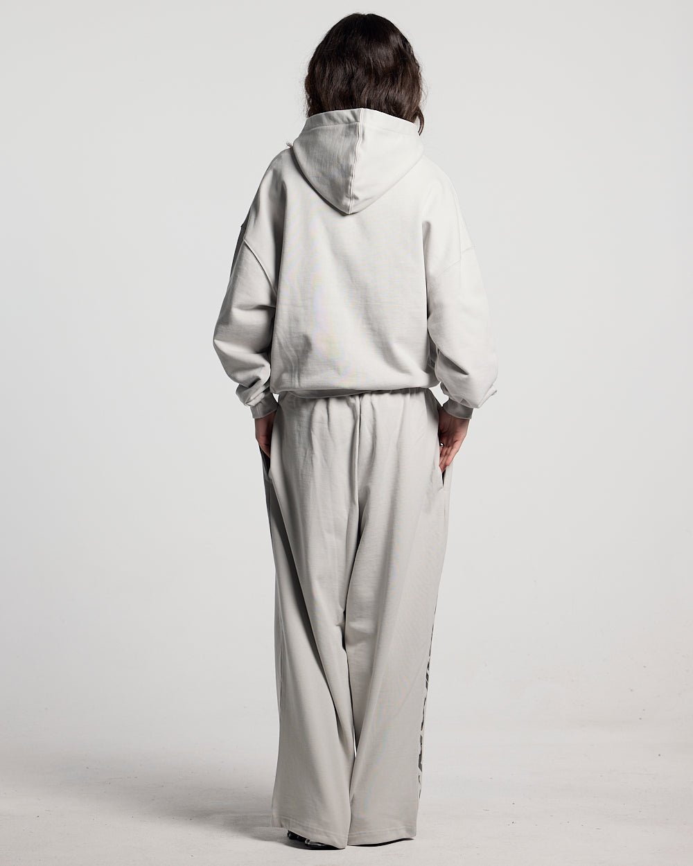 WILD CAMO SWEATPANTS LIGHT GREY - light grey baggy sweatpants, back view on female model - Cold Culture #woman