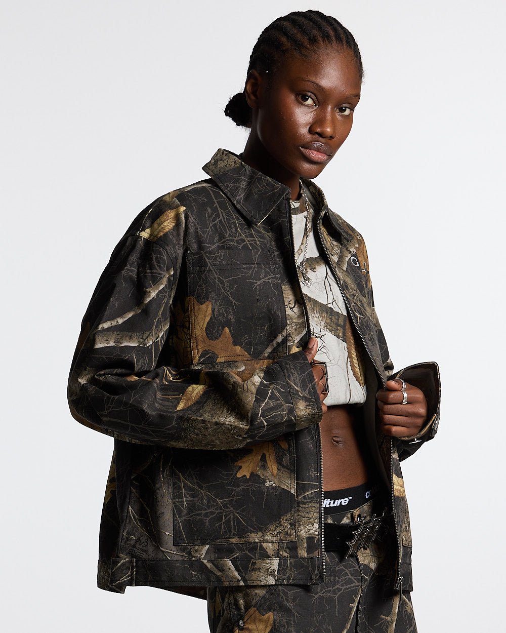 WORK ZIP JACKET REALTREE BLACK - black realtree camo work jacket, front view on female model - Cold Culture #woman