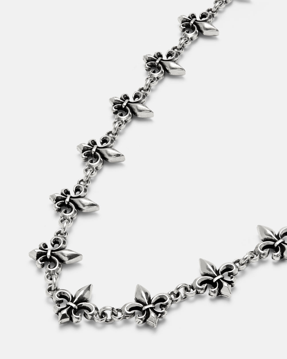 LOOSE ICON NECKLACE SILVER - silver fleur-de-lis chain necklace, detail close-up - Cold Culture