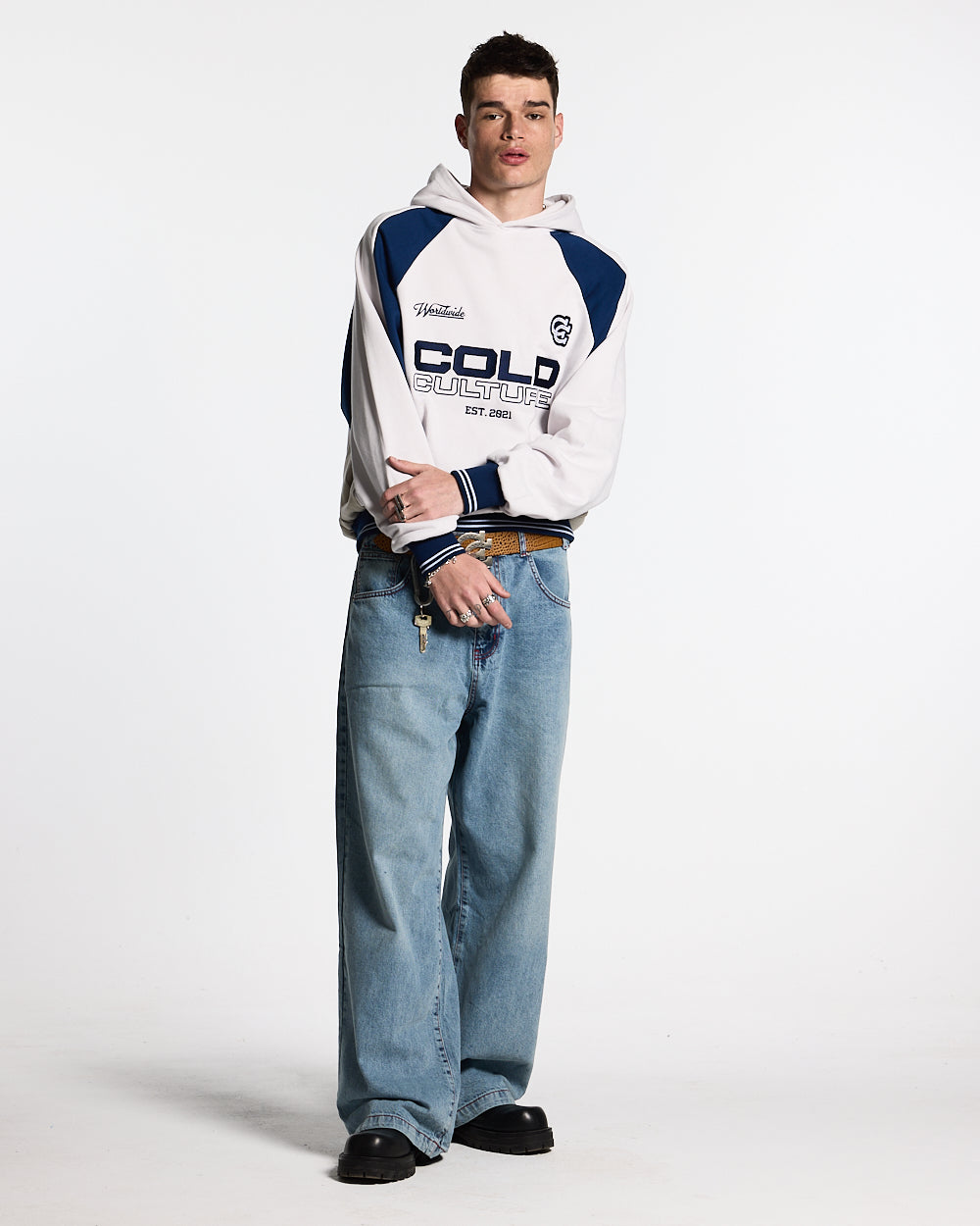 COWBOY V1 PANTS BLUE DENIM - light blue baggy denim pants, front view on male model - Cold Culture #man