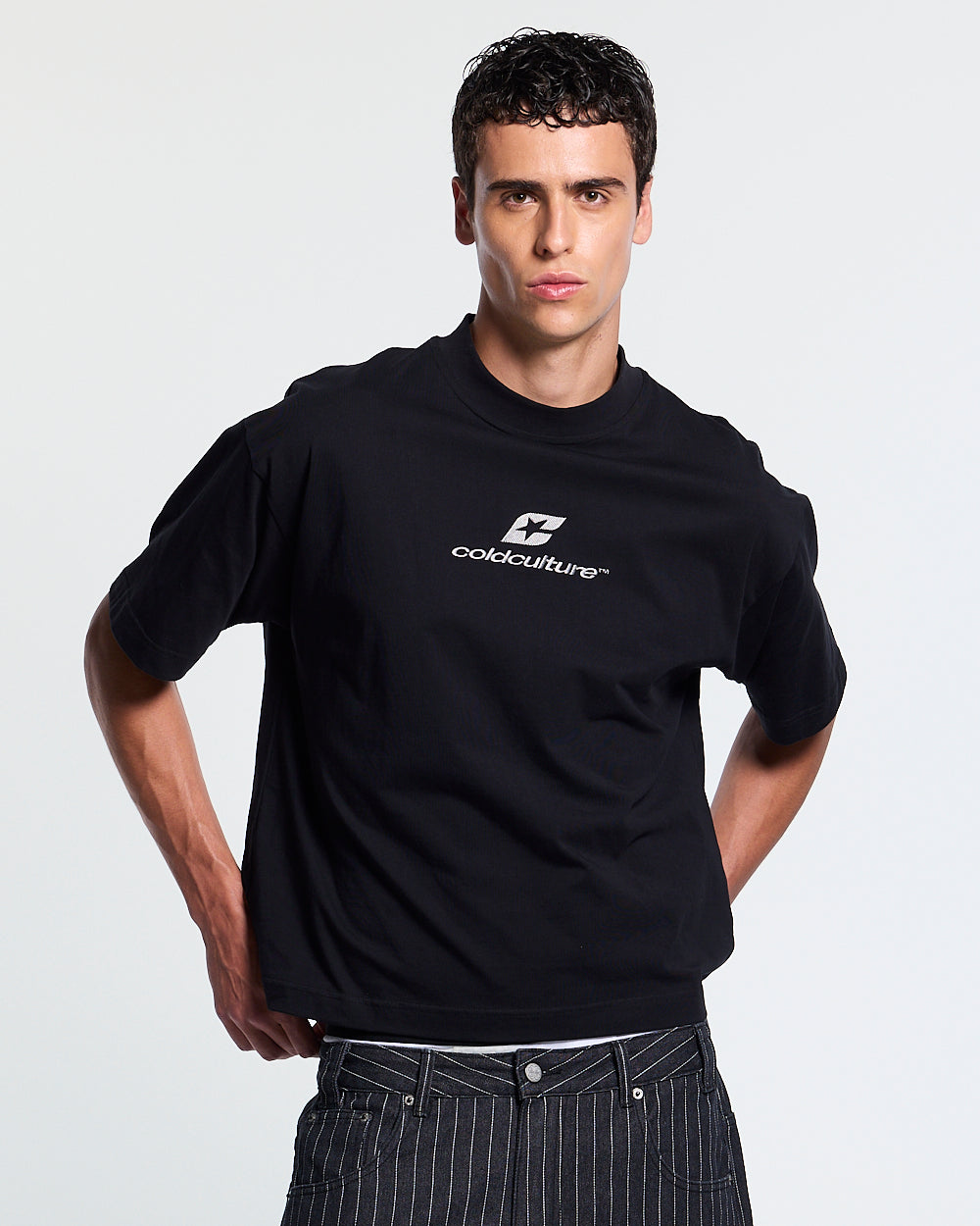 TARTAN DISTRESS CURVED TEE BLACK - black distressed print tee, front view on male model - Cold Culture #man
