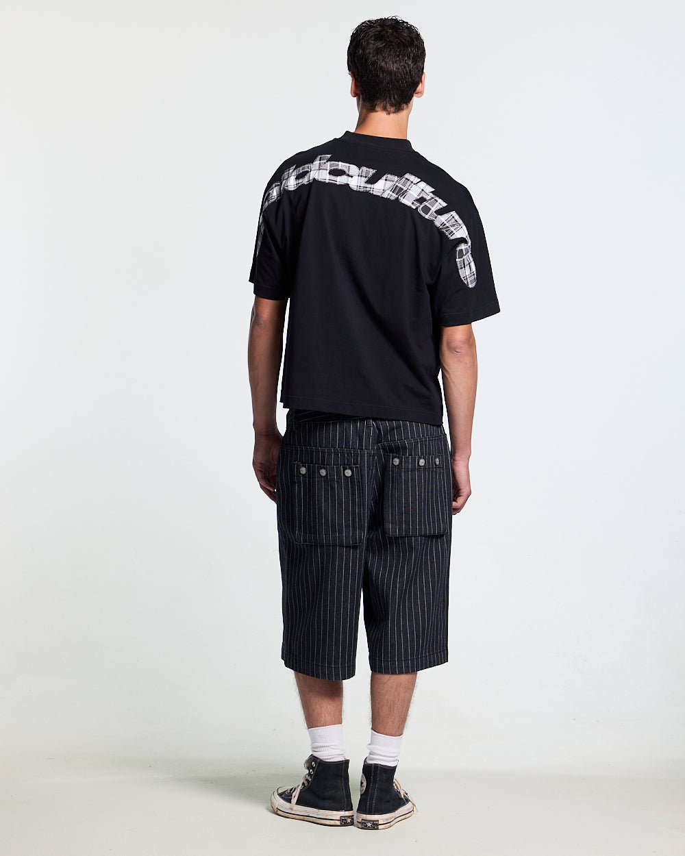 TARTAN DISTRESS CURVED TEE BLACK - black distressed print tee, back view on male model - Cold Culture #man