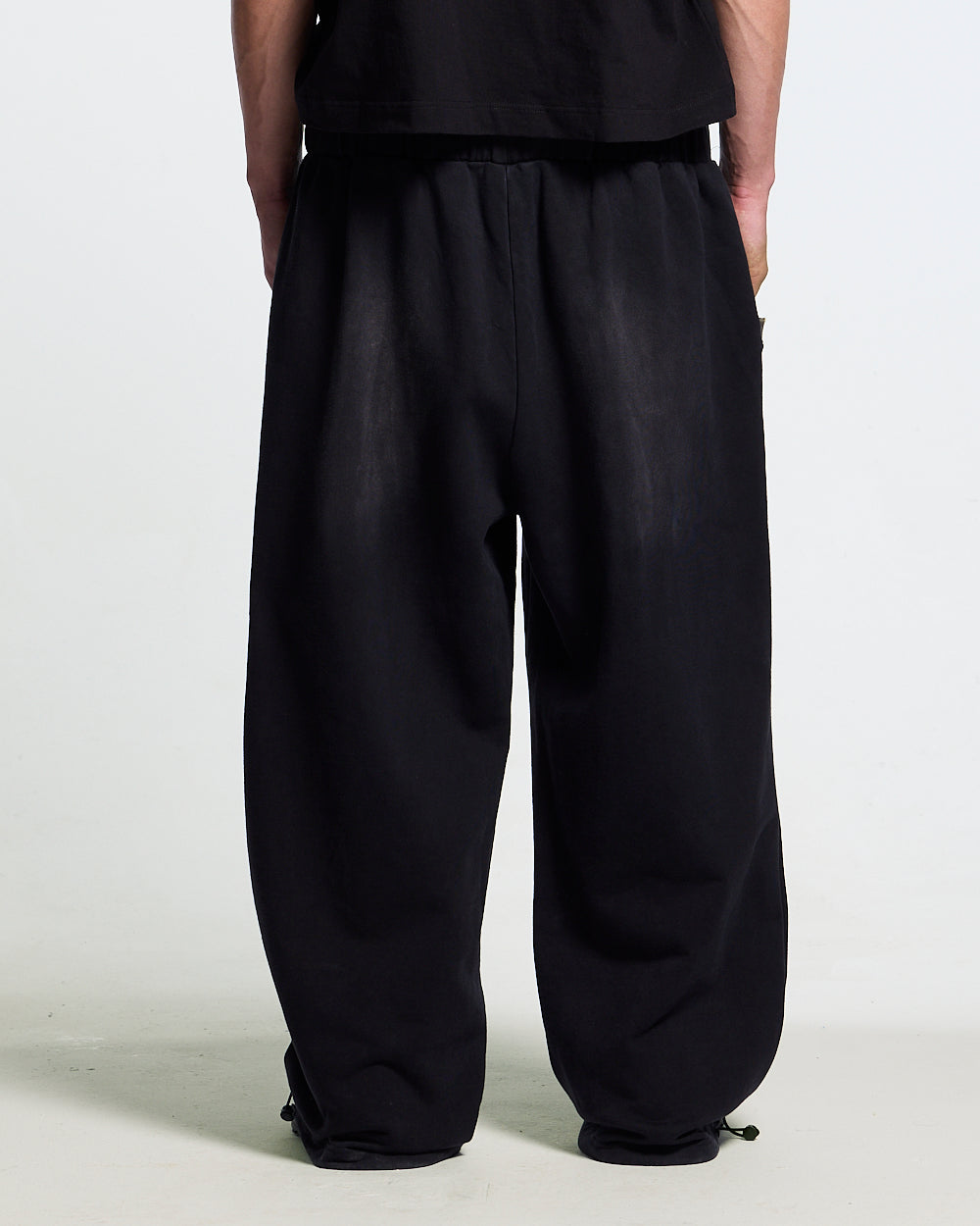BLACK OPS SWEATPANTS BLACK - washed black sweatpants, back view on male model - Cold Culture