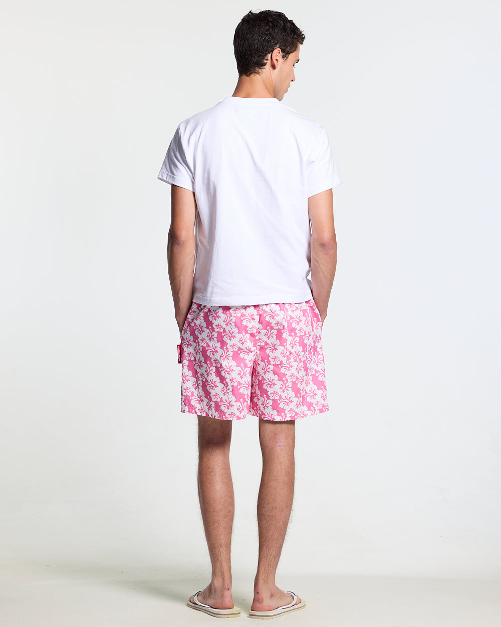 ALOHA SWIMSHORTS PINK - pink floral swim shorts, back view on male model - Cold Culture #man