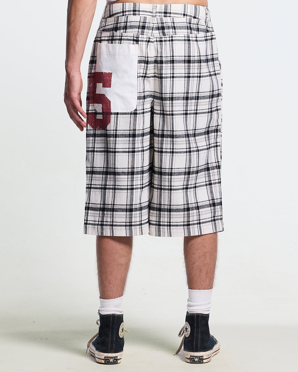DINING CHECK JORTS BLACK - black and white checkered shorts, front view on male model - Cold Culture