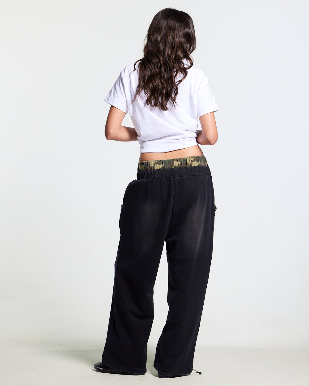 BLACK OPS SWEATPANTS BLACK - washed black sweatpants, back view on female model - Cold Culture #woman