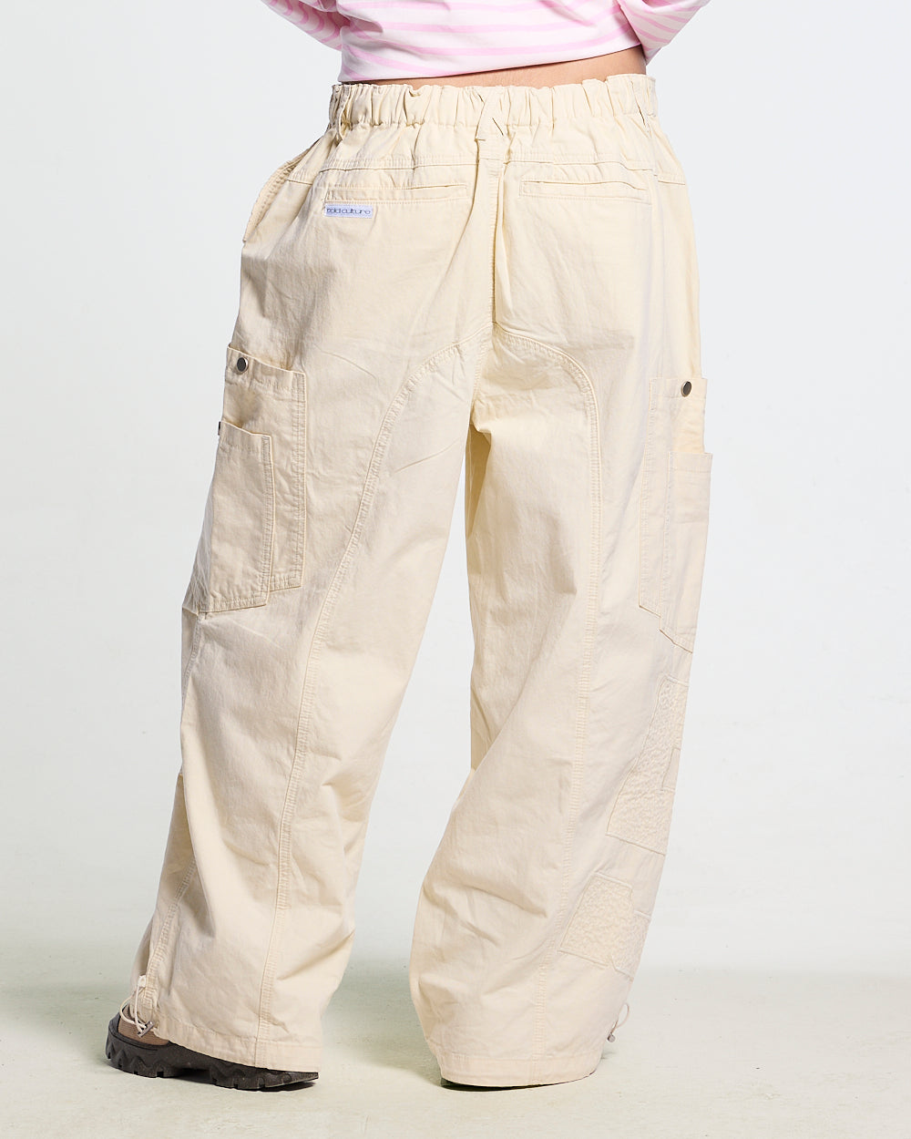 SOLID CARGO PANTS WHITE - off-white cargo pants, back view on female model - Cold Culture #woman