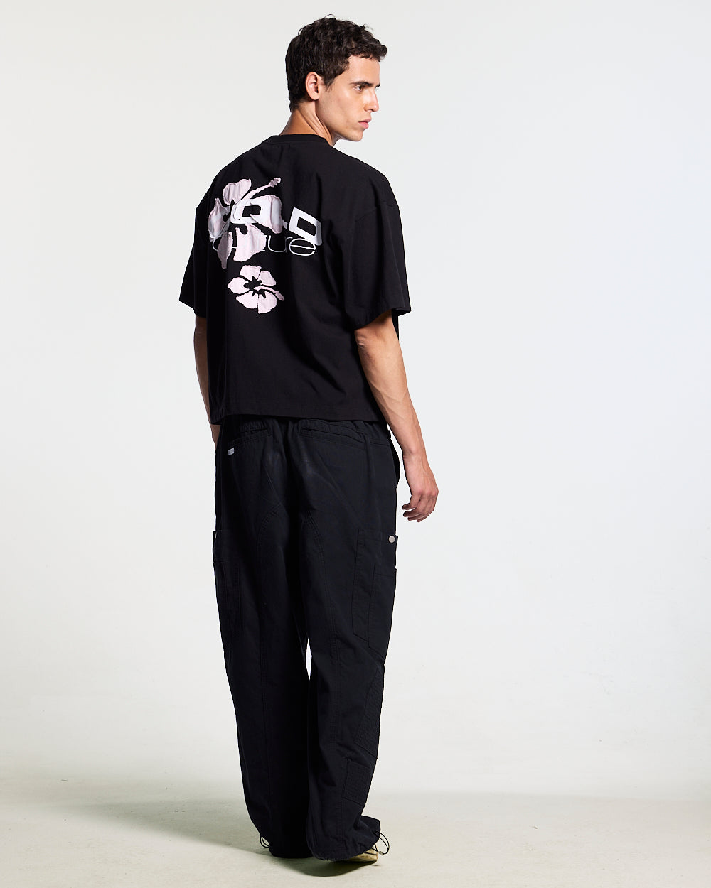 TROPICAL FEVER TEE BLACK - black hibiscus print tee, back view on male model - Cold Culture #man