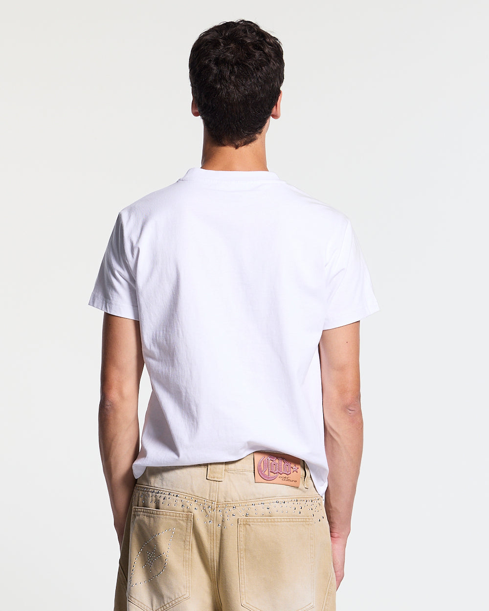 STARSTRUCK TEE WHITE - white studded logo tee, back view on male model - Cold Culture #man