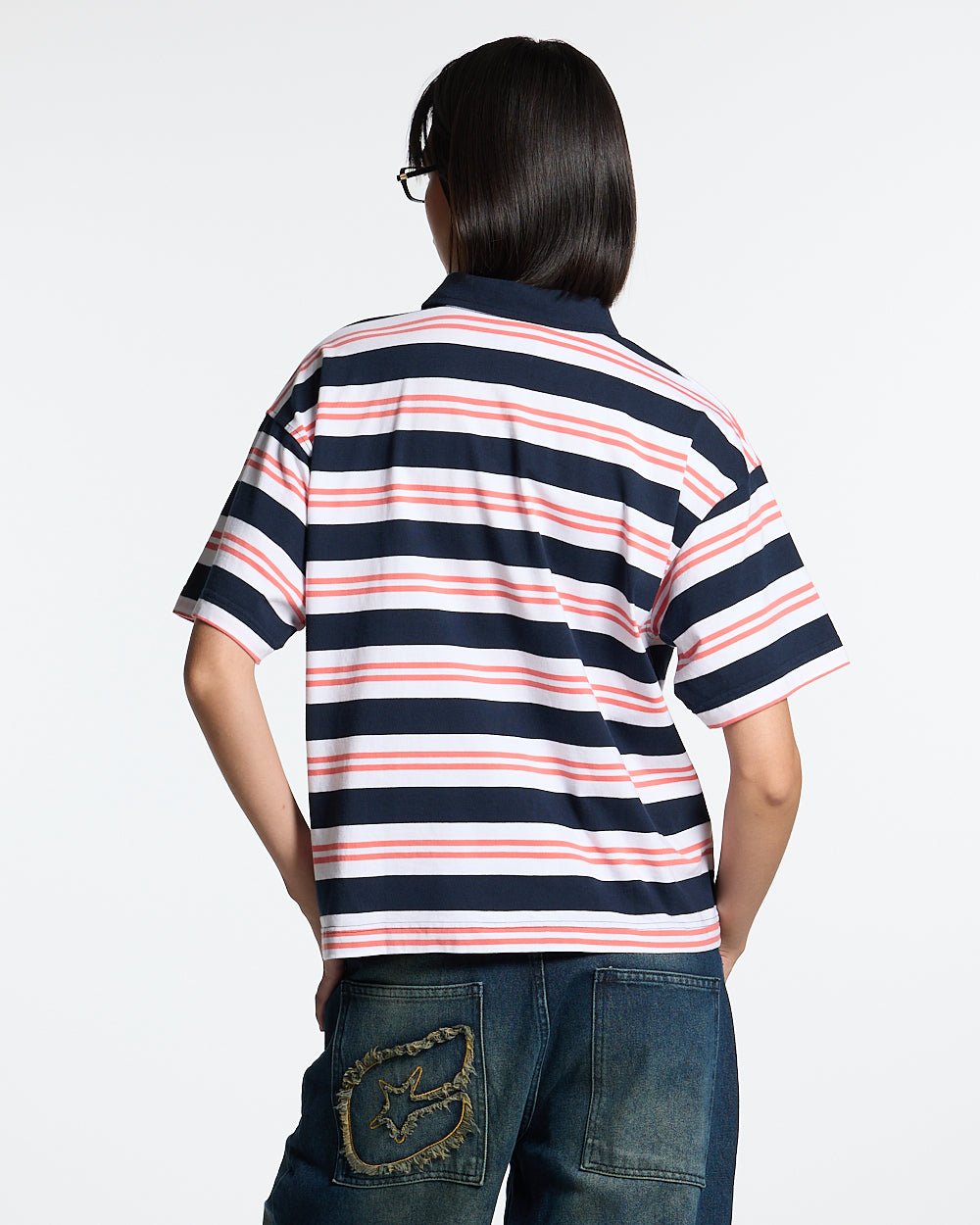 AEROSTRIPES POLO BLUE SEA/CORAL - navy and coral striped polo shirt, back view on female model - Cold Culture #woman