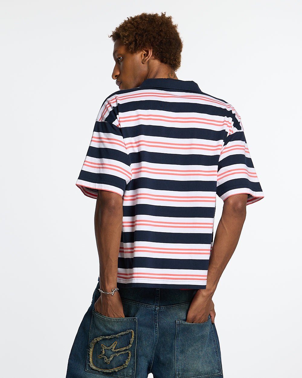 AEROSTRIPES POLO BLUE SEA/CORAL - navy and coral striped polo shirt, back view on male model - Cold Culture #man