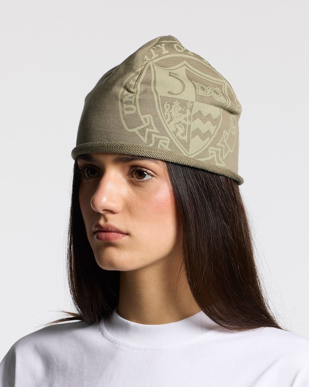 ARMOUR BEANIE MILITARY GREEN - military green graphic print beanie, on model close-up - Cold Culture #woman