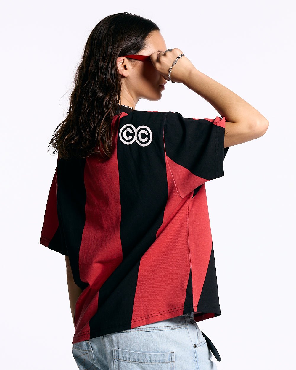 ASLANT STRIPES POLO TEE BLACK AND RED - red and black striped polo shirt, back view on female model - Cold Culture #woman