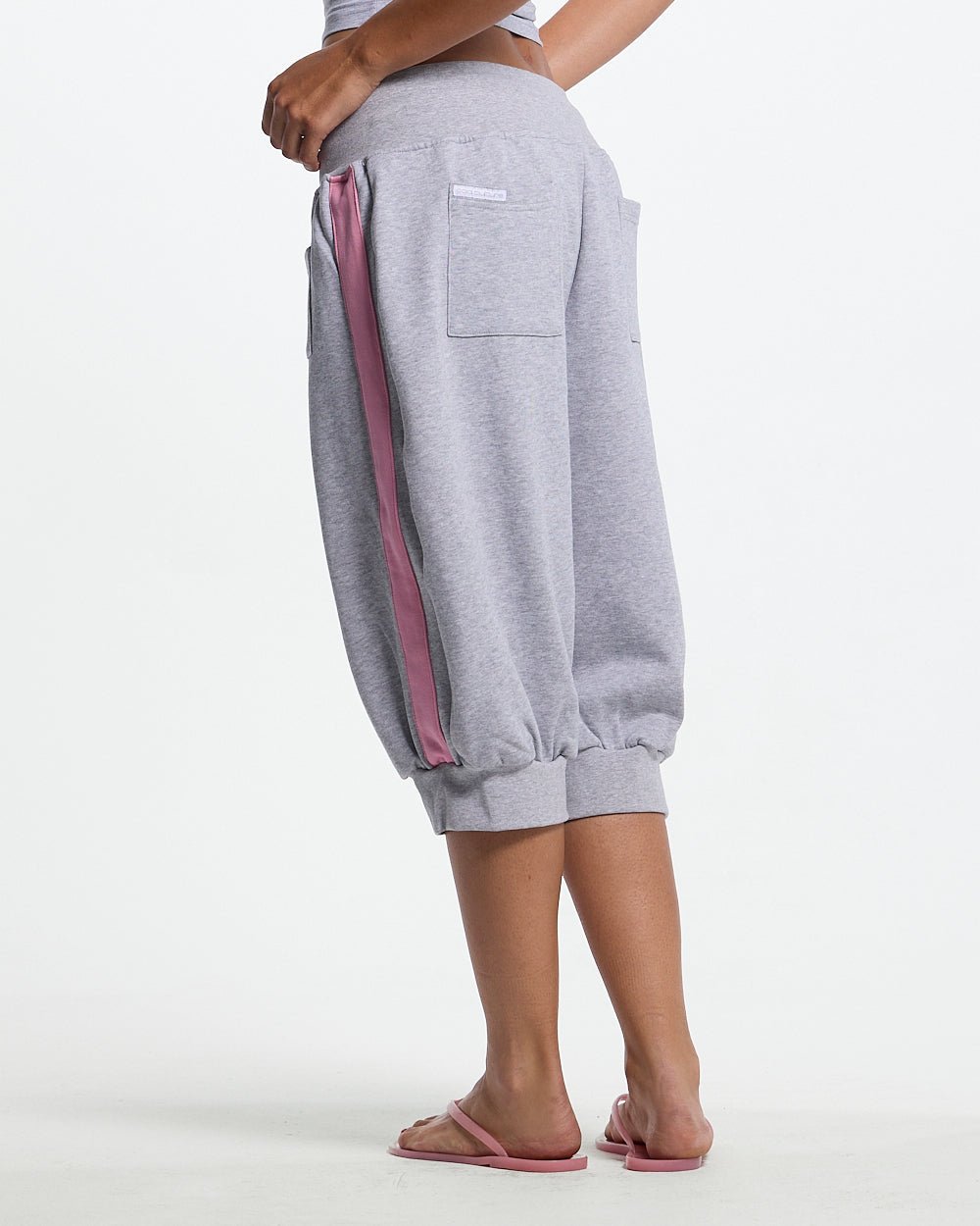B-BOY CAPRI PANTS HEATHER GREY - heather grey capri sweatpants, back view on female model - Cold Culture #woman
