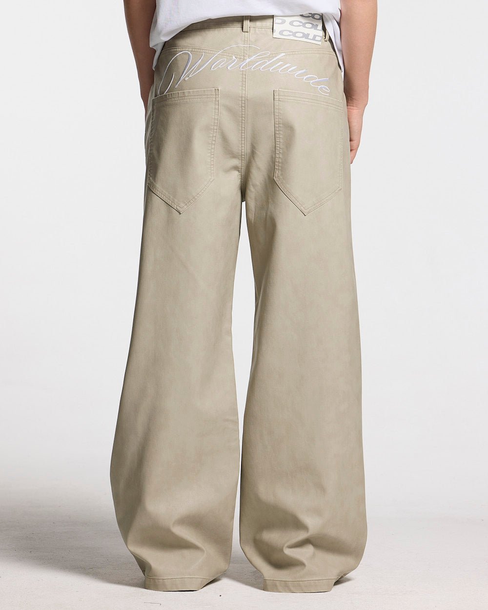 BACKTALK V3  PANTS CREAM - cream baggy pants, back view on female model - Cold Culture #woman