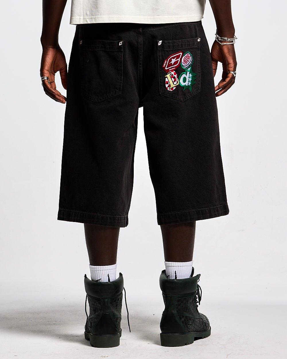 BADGES JORTS BLACK LICORICE - black baggy denim shorts, back view on male model - Cold Culture