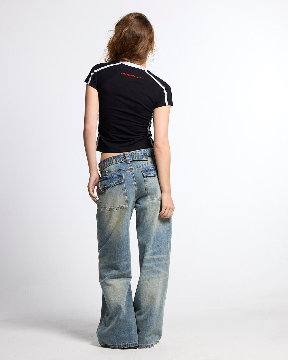 BANDAL BABY TEE BLACK - black varsity baby tee, back view on female model - Cold Culture #woman