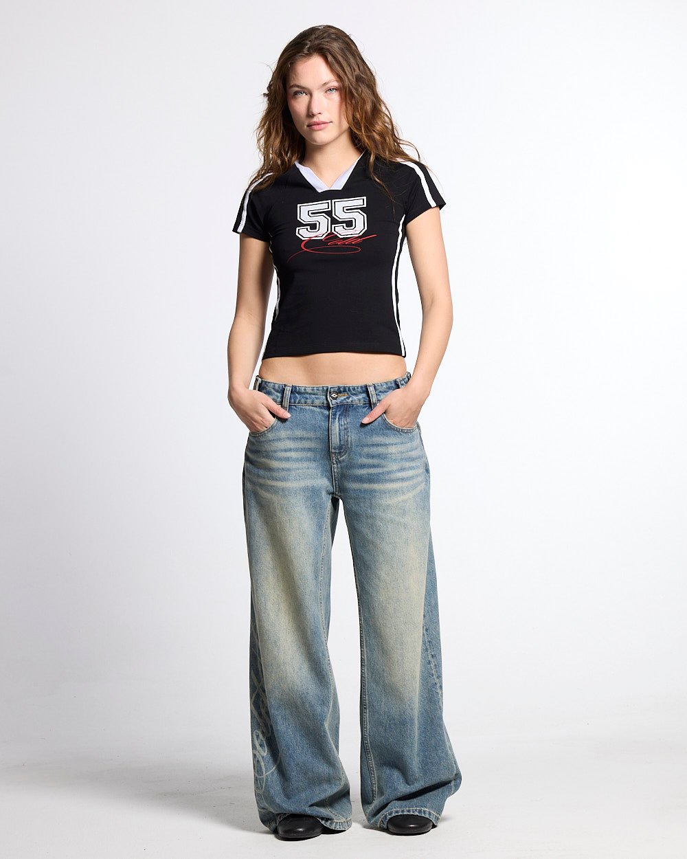 BANDAL BABY TEE BLACK - black varsity baby tee, front view on female model - Cold Culture #woman
