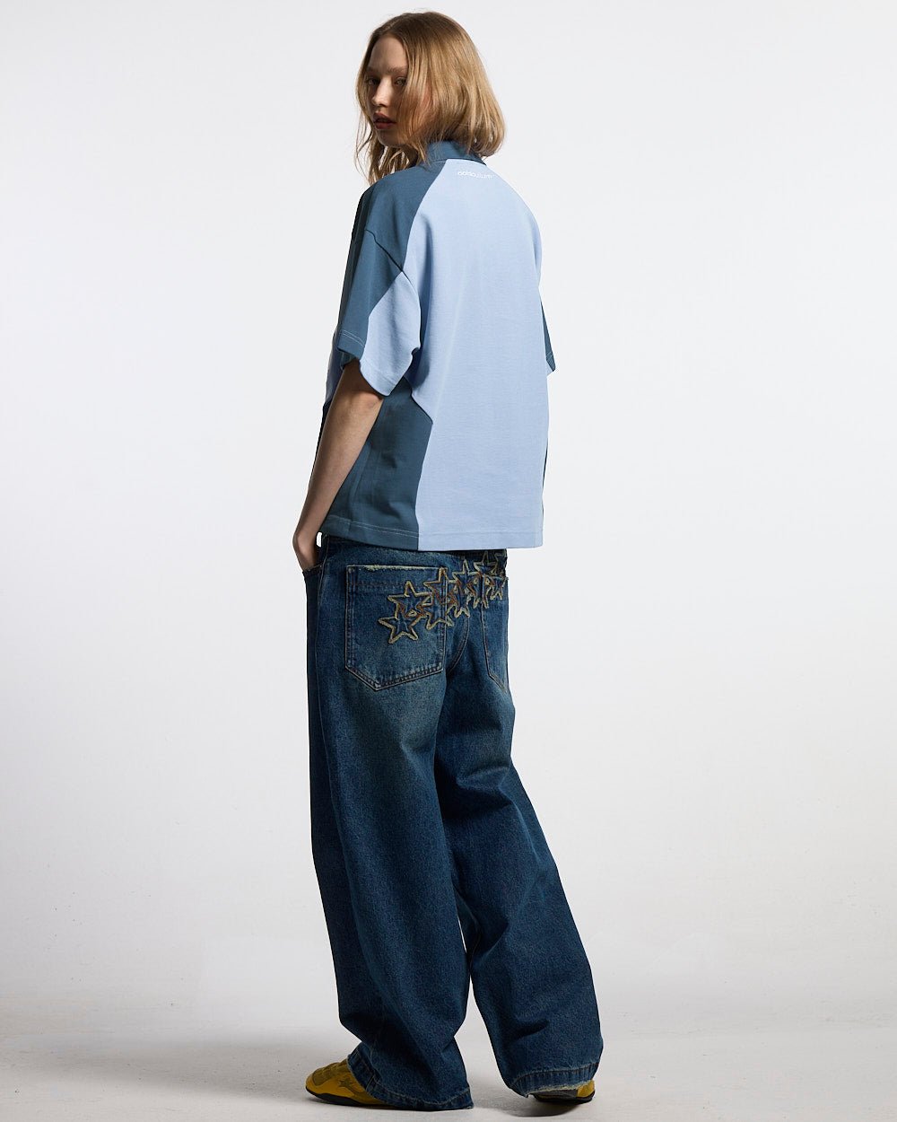 BIKER POLO LIGHT BLUE - light blue half-zip polo, back view on female model - Cold Culture #woman