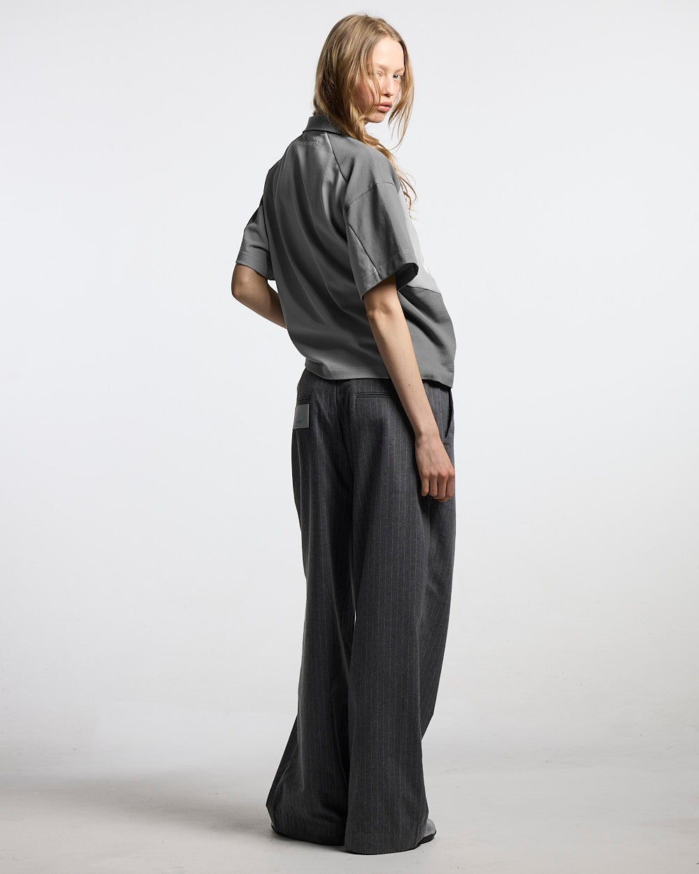 BIKER POLO LIGHT GREY - light grey half-zip polo, back view on female model - Cold Culture #woman