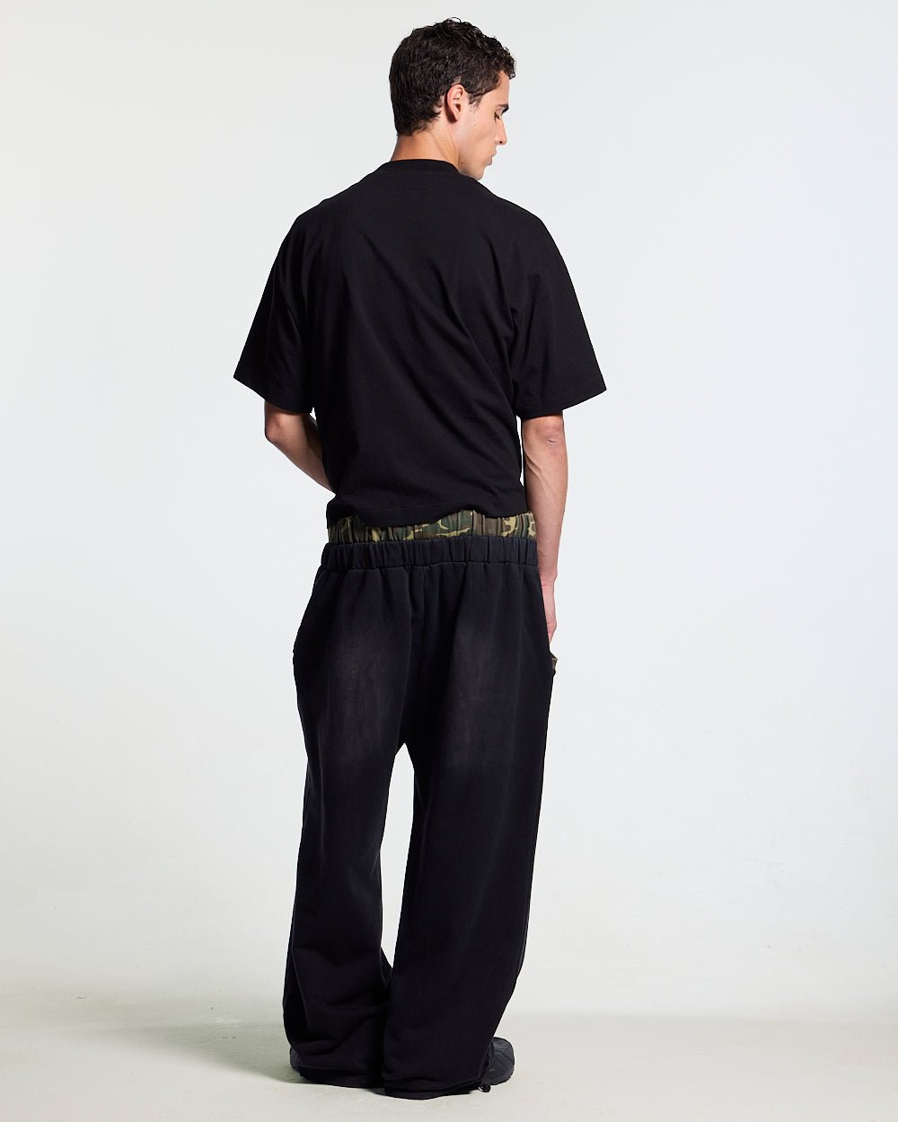 BLACK OPS SWEATPANTS BLACK - washed black sweatpants, back view on male model - Cold Culture #man