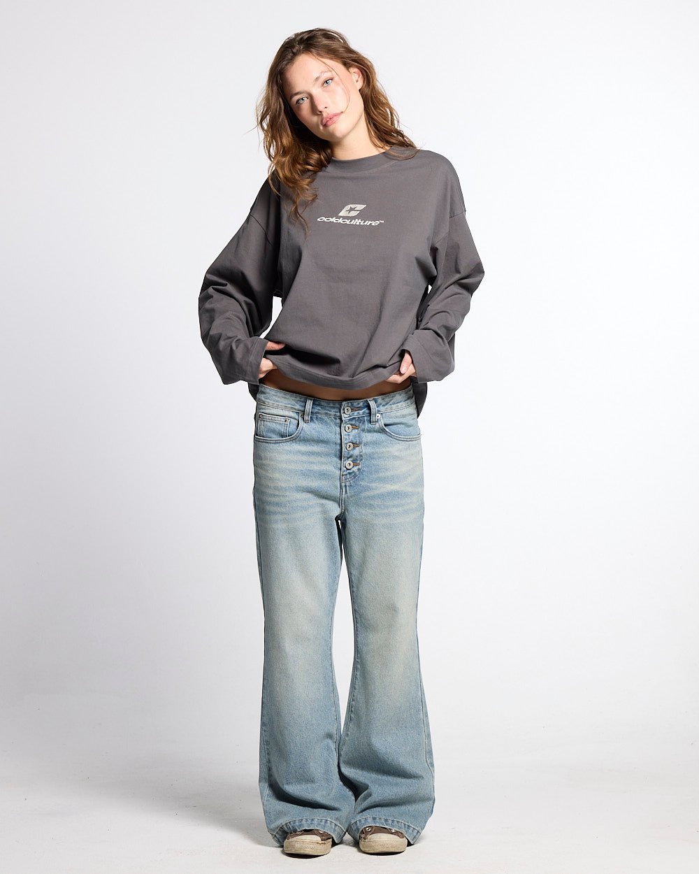 BLURRED V5 BOOTCUT PANTS LIGHT DENIM - light wash denim bootcut pants, front view on female model - Cold Culture #woman