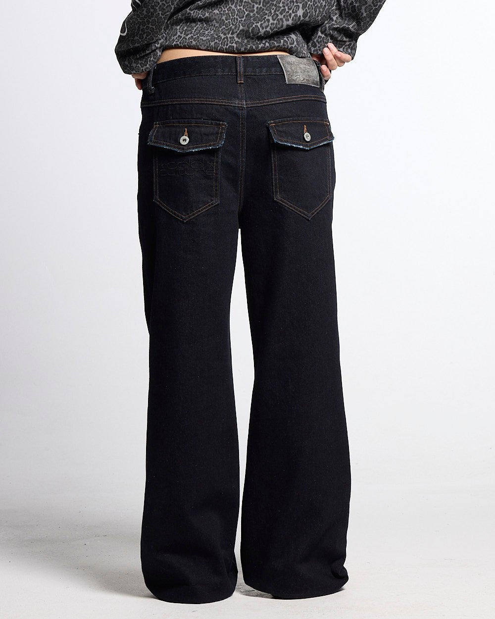 BLURRED V5 BOOTCUT PANTS RAW DENIM - raw denim bootcut pants, back view on female model - Cold Culture #woman