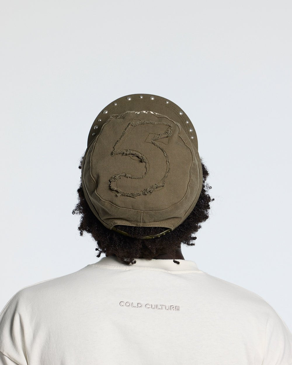 BOSSMAN CAP BROWN - brown studded cap, back view on male model - Cold Culture #man