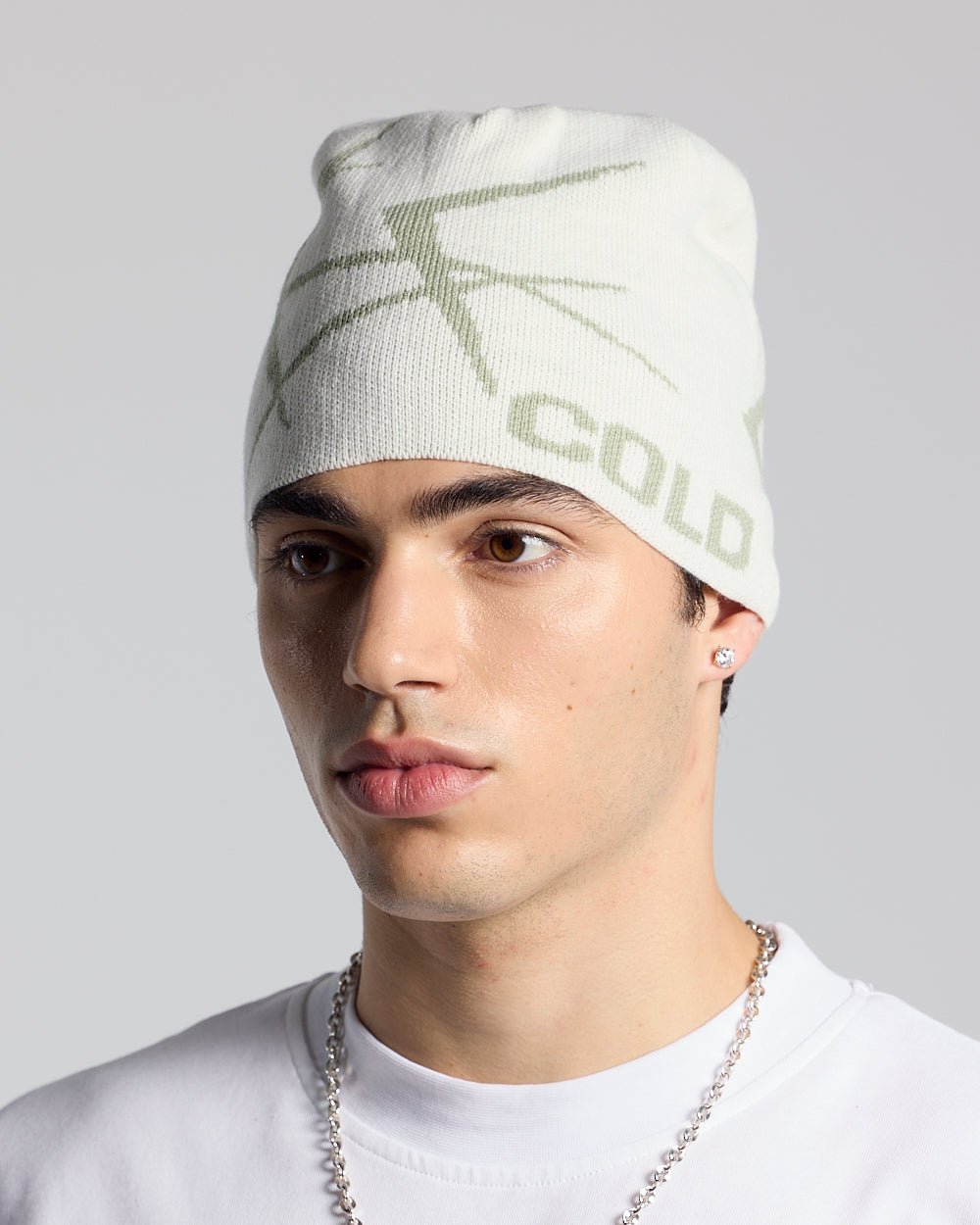 BRAMBLES BEANIE CREAM - cream patterned beanie, on model close-up - Cold Culture #man