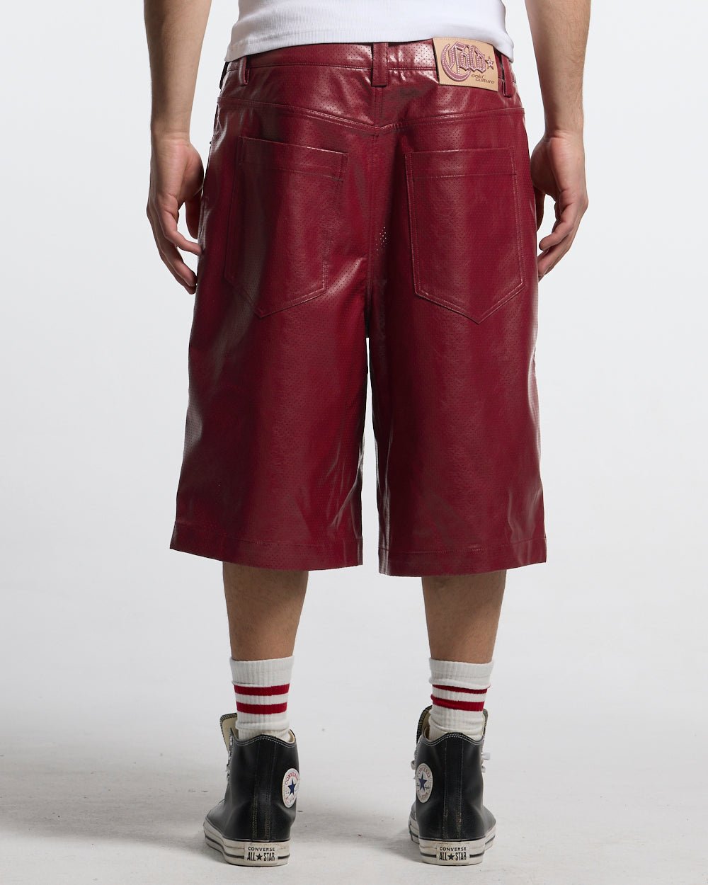 BRAVE SHORT BURGUNDY - burgundy perforated leather shorts, back view on male model - Cold Culture
